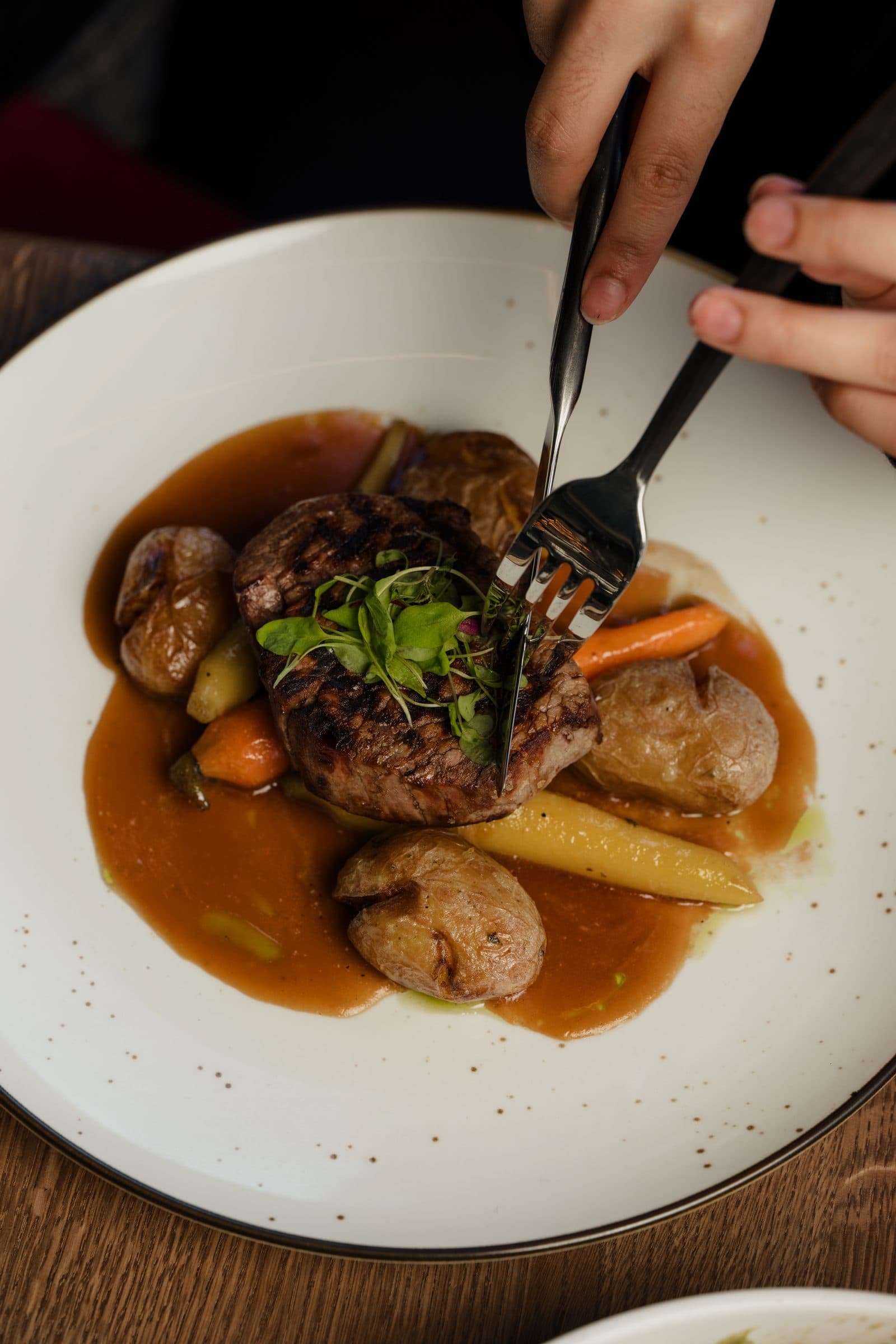 Filet mignon with roasted potatoes, carrots and demi-glace
