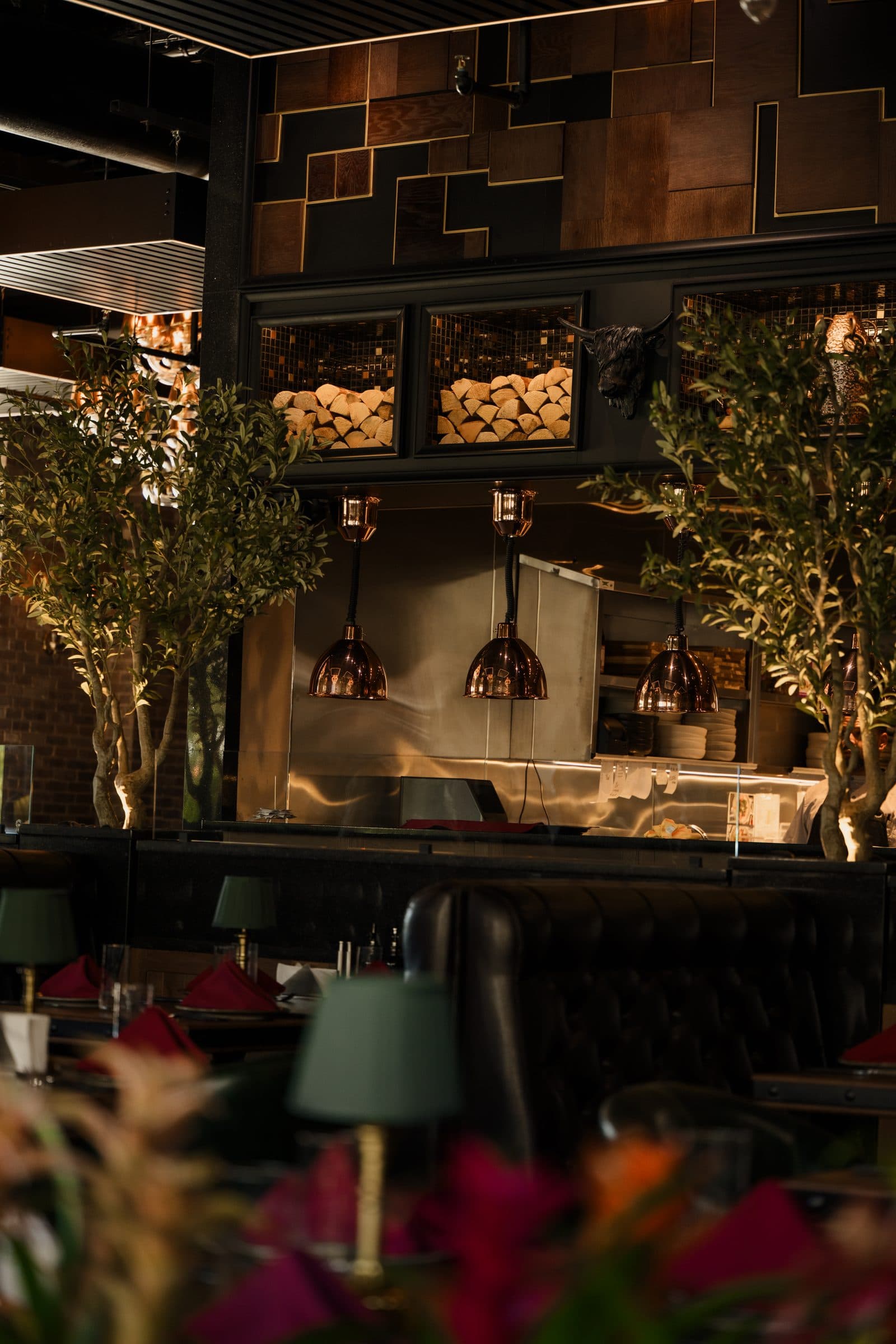 Olive trees and the open kitchen behind the dining room